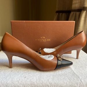 COACH heels. NEW!! Leather tan body with black cap toe. Gold hardware